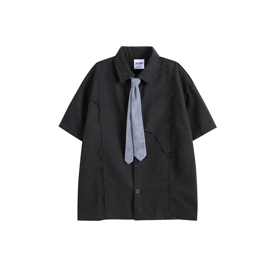 Black short-sleeve button-up shirt with frayed seam details, pointed collar and a blue-gray tie, flat lay