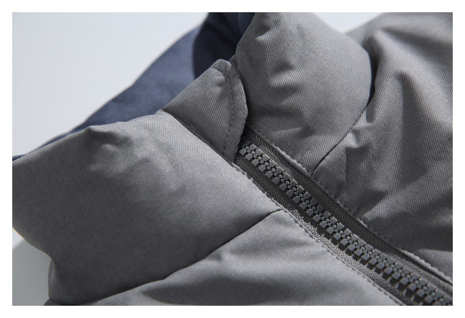 Close-up of a gray jacket collar and chunky front zipper.