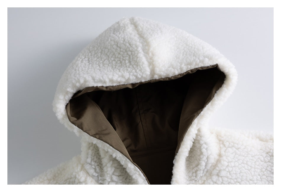 Close-up of the ivory sherpa hood showing its dark brown lining and inner seams.