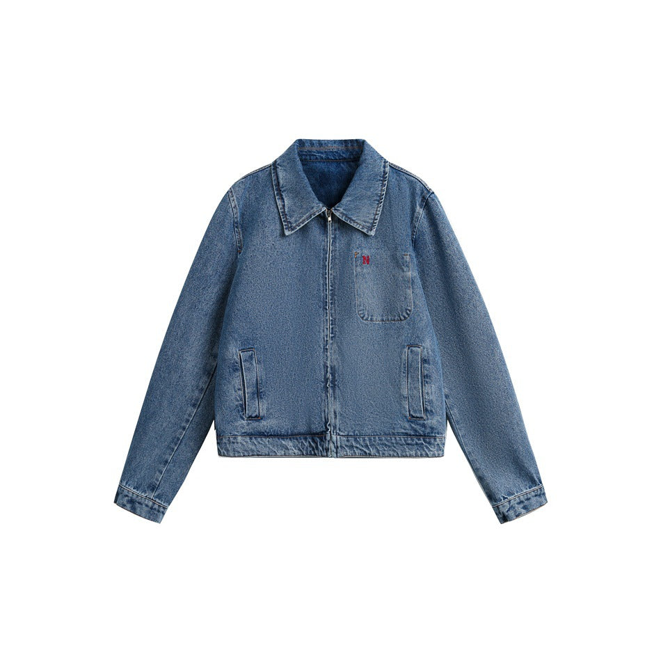 Blue washed denim jacket flat front view with pointed collar, front zip, chest pocket and angled side pockets