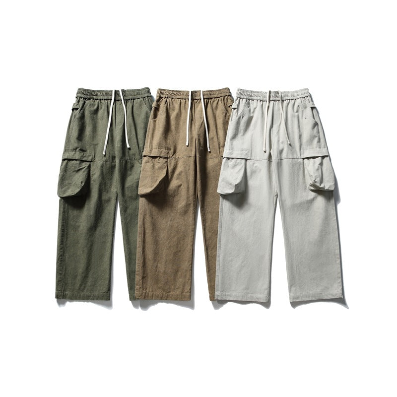 Three front views of wide-leg cargo pants with elastic waists and drawstrings in dark olive, brown, and light gray.