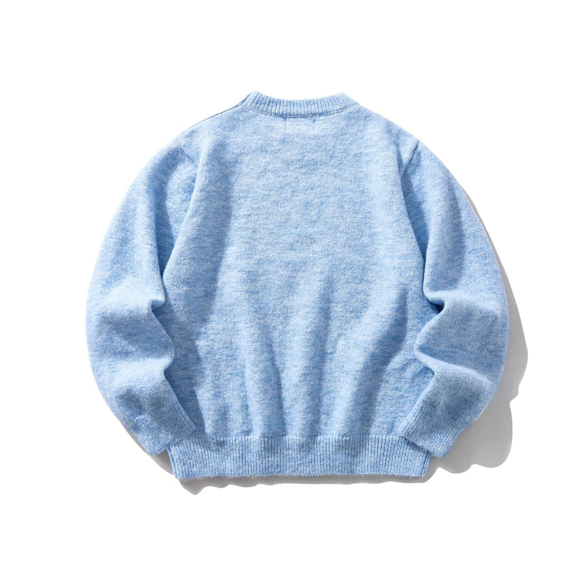Back view of a pale blue crewneck knit sweater laid flat.