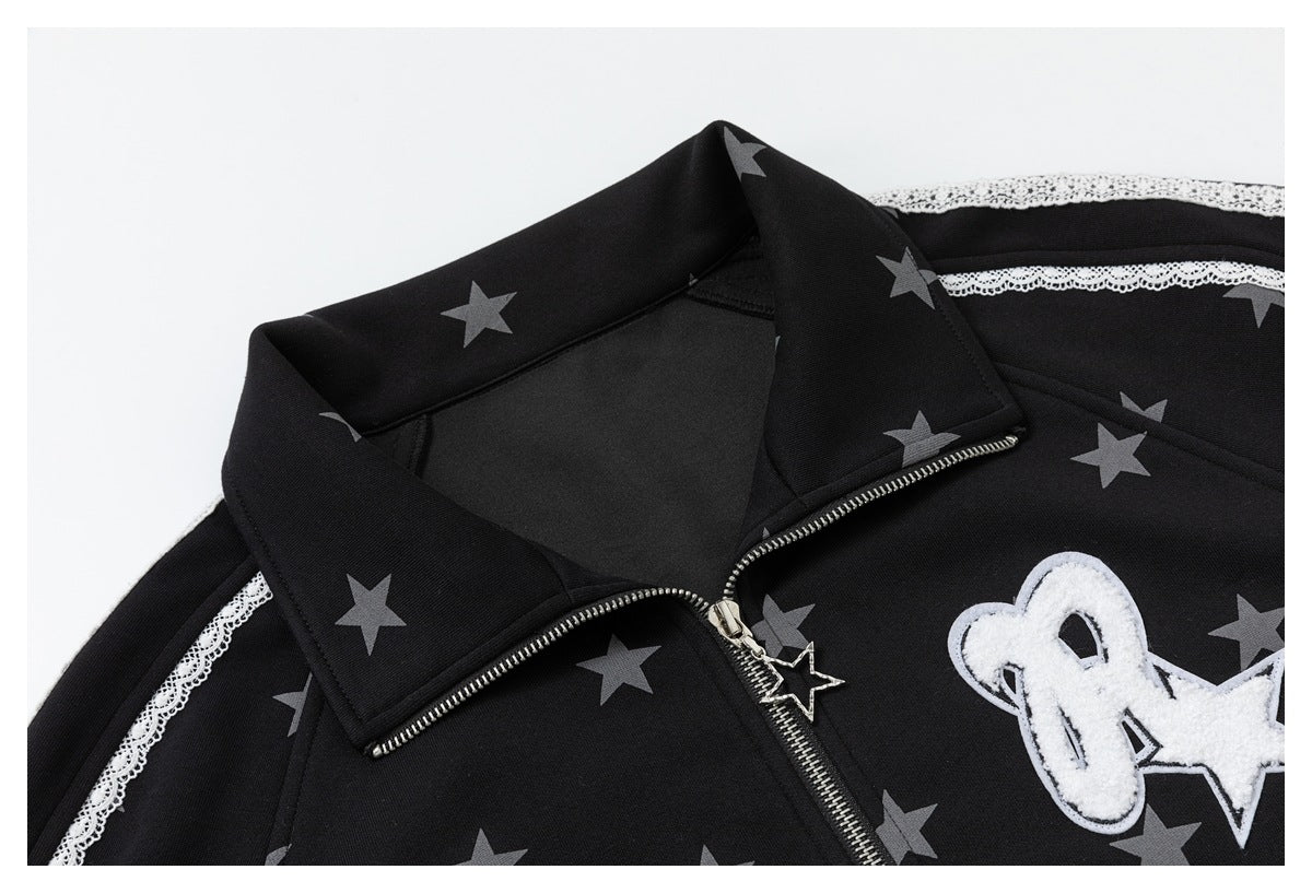Close-up of a black star-print jacket with a wide collar, silver zipper, white lace trim and fuzzy chest patch.