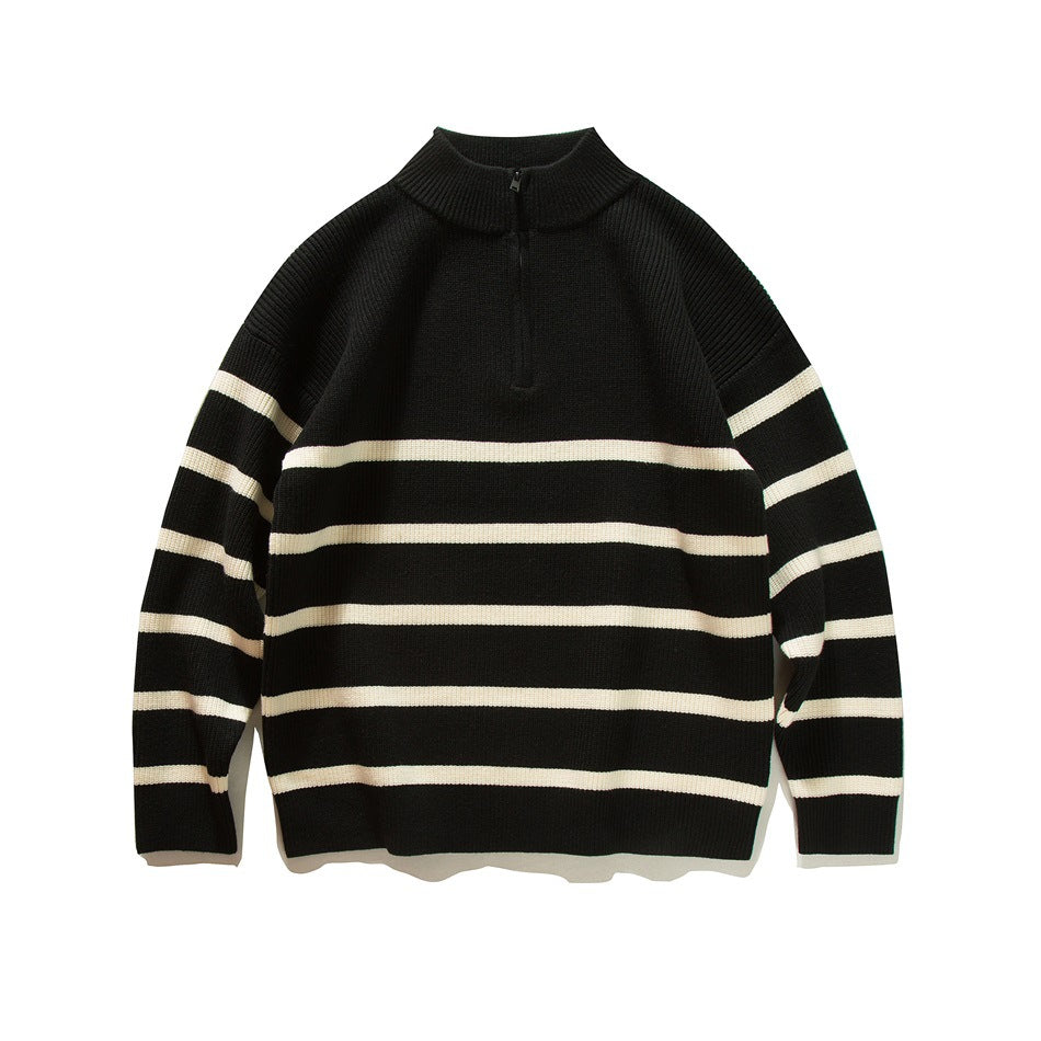 Black knit half-zip sweater with cream horizontal stripes, front flat lay