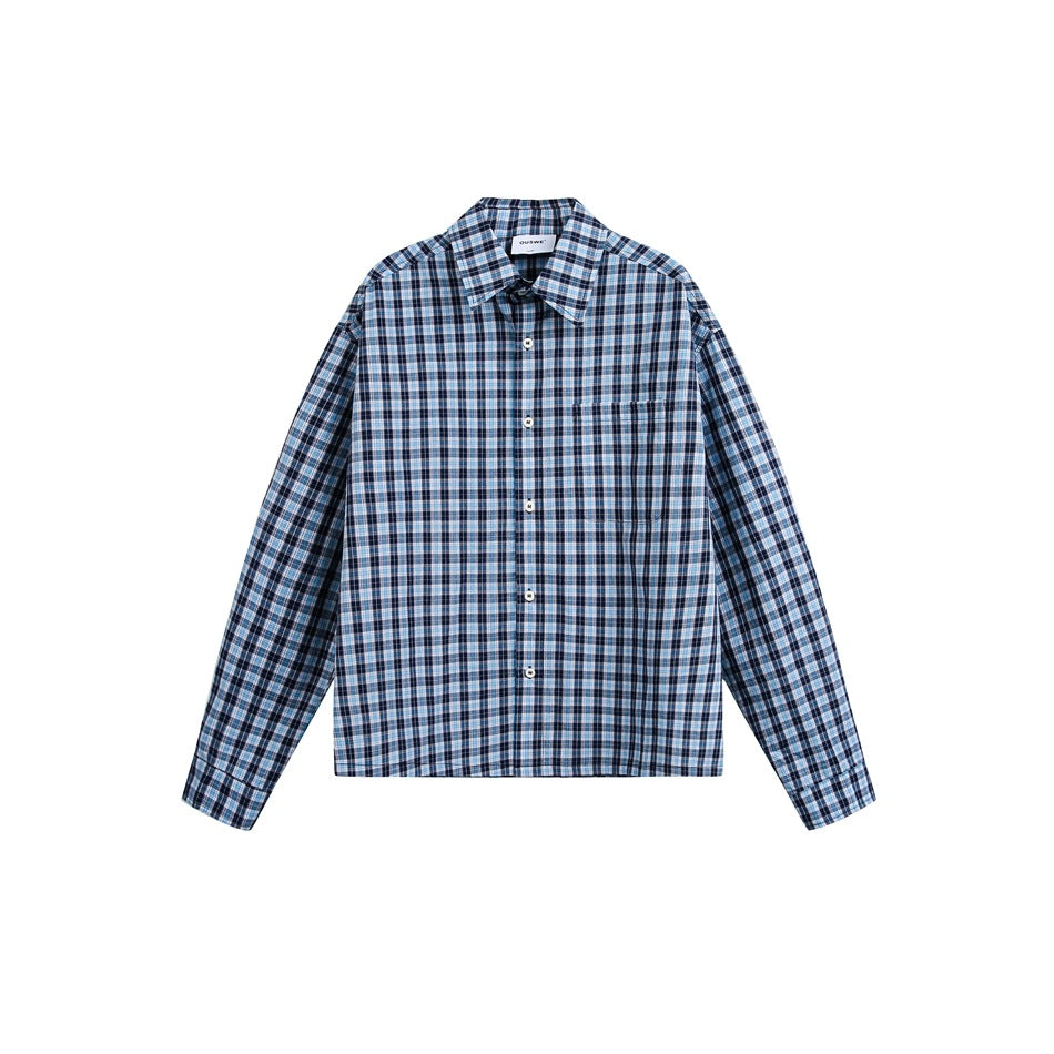 Navy, light blue and white plaid long-sleeve button-up shirt with chest pocket, flat front view on white