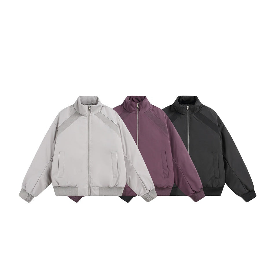 Three front-view zip-up jackets in light gray, plum, and black, with stand collars and ribbed cuffs and hems.
