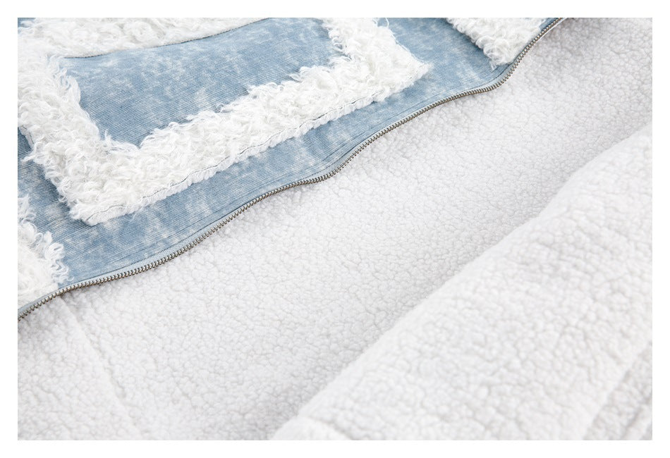 Close-up of the jacket's white plush lining beside a denim panel and zipper.
