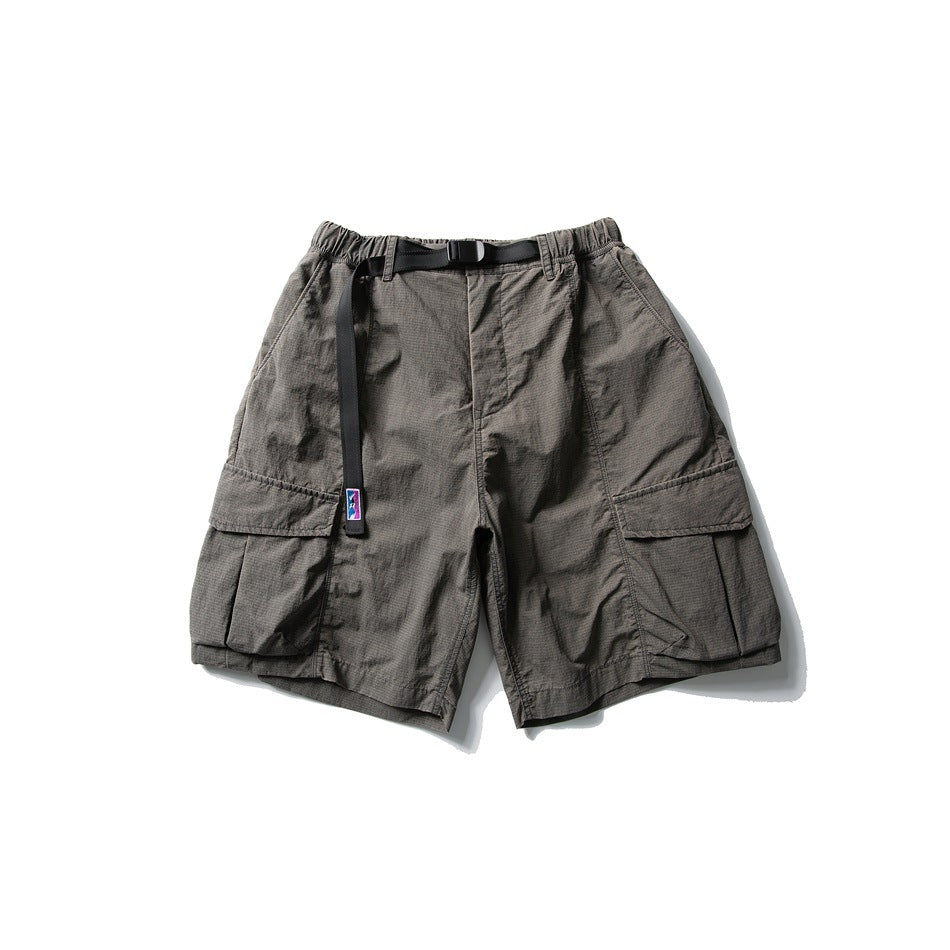 Charcoal gray cargo shorts with elastic waist, black buckle belt and large flap thigh pockets, flat lay front view