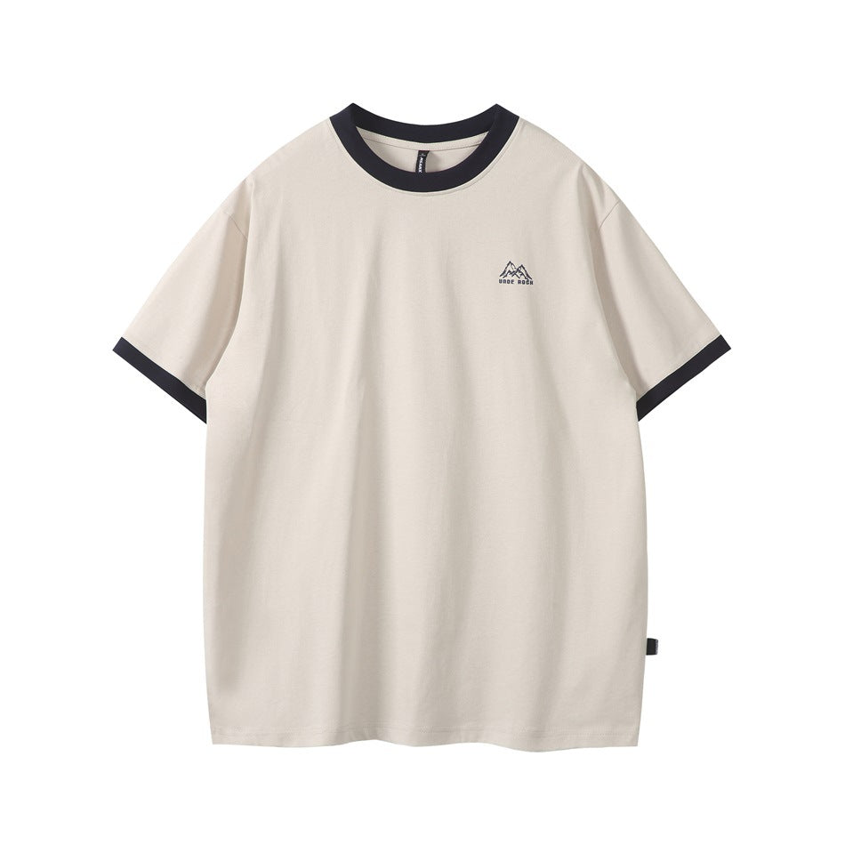 Front view of a cream short-sleeve T-shirt with a dark navy crew neck, sleeve trim, and small mountain chest logo.