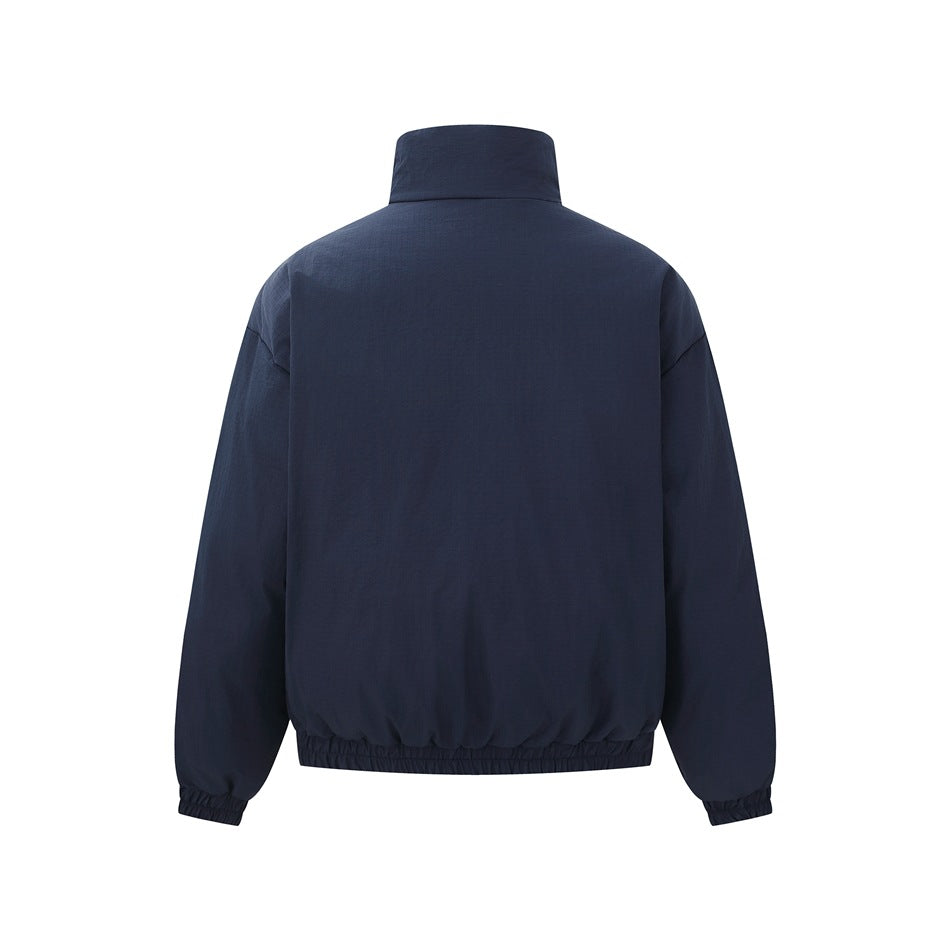 Back view of a solid navy jacket with a high collar, long sleeves, elastic cuffs, and gathered hem.