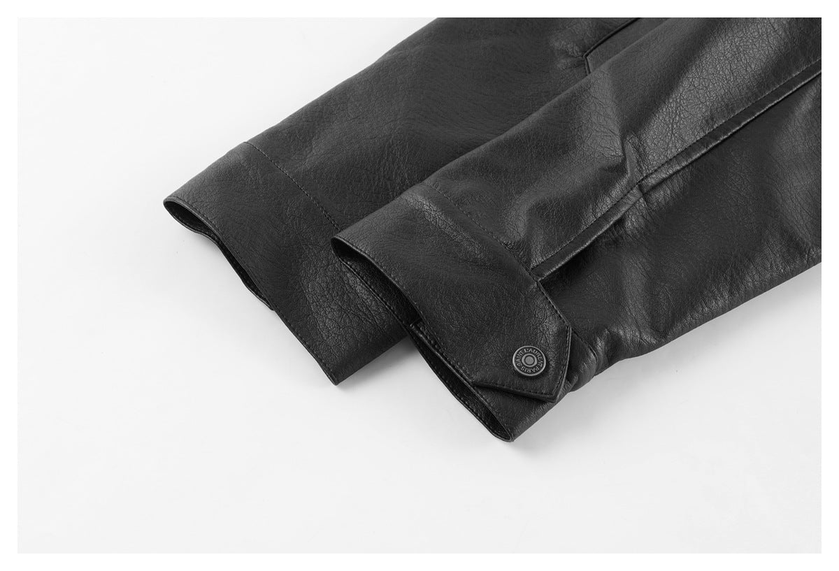Close-up of the black jacket's sleeve cuffs and buttoned cuff tab.