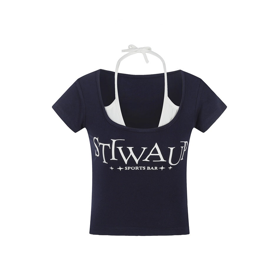 Navy cropped short-sleeve tee with scoop neck, white halter layer and white chest lettering print, flat view