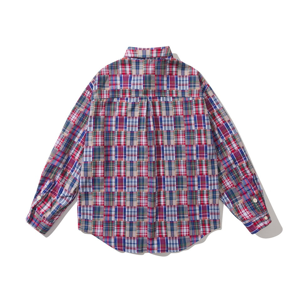 Back view of a long-sleeved button-up shirt in red, blue, gray, and white plaid, with a horizontal yoke and center pleat.