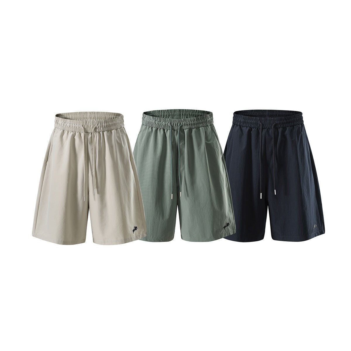 Three front views of wide-leg drawstring shorts in beige, muted green, and navy.