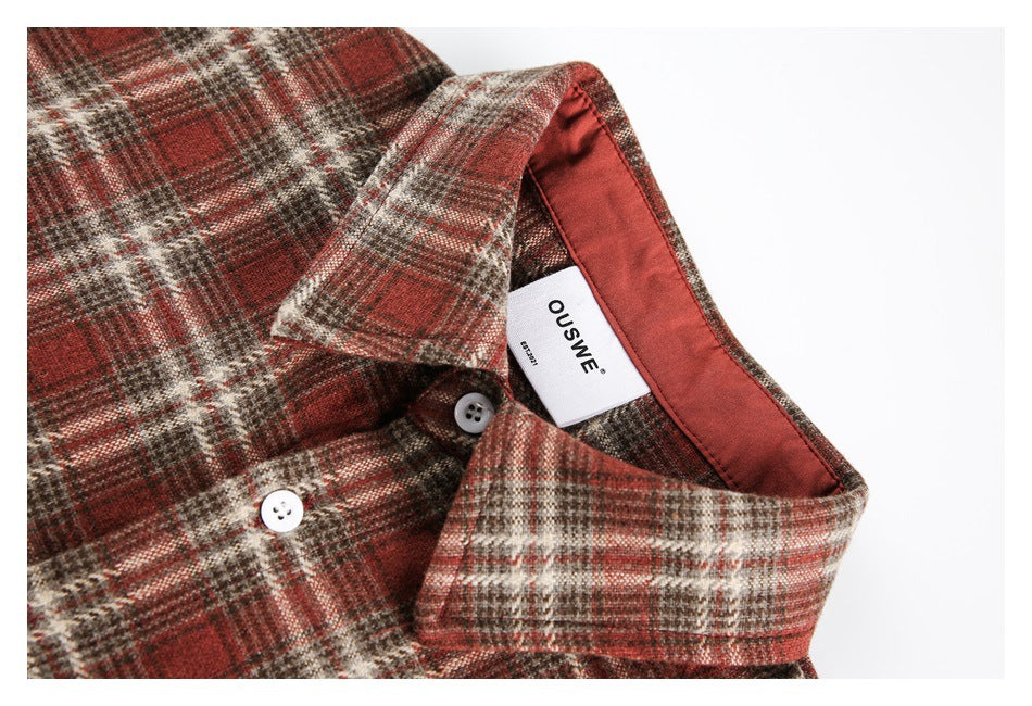 Close-up of the plaid shirt collar, white buttons, rust lining, and sewn-in OUSWE label.