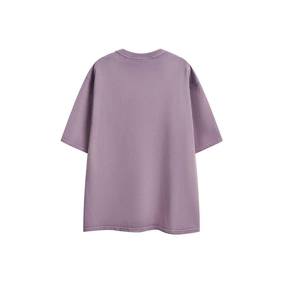 Back view of an oversized muted-purple short-sleeve crew-neck T-shirt against a white background.