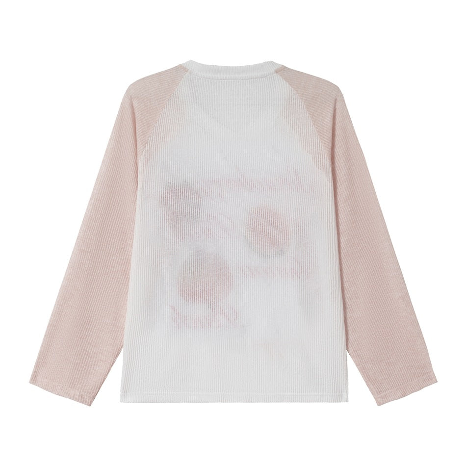 Back view of pink and white ribbed raglan long-sleeve top with the front print showing faintly through