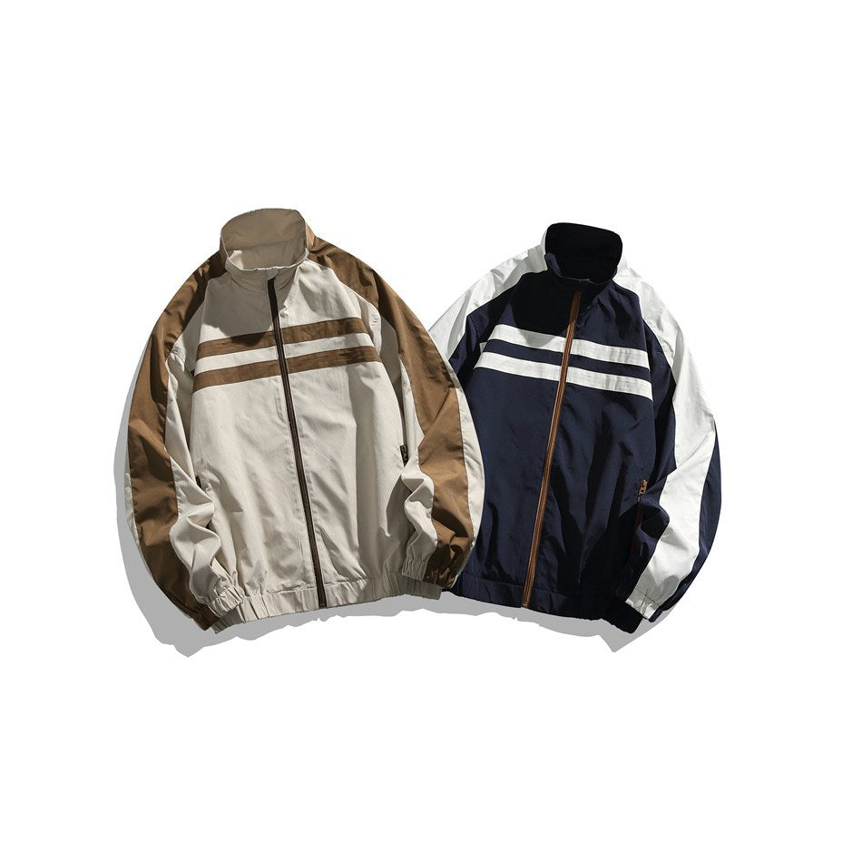 Two front-view colorways of a zip jacket: cream and brown, and navy with white sleeves and stripes.