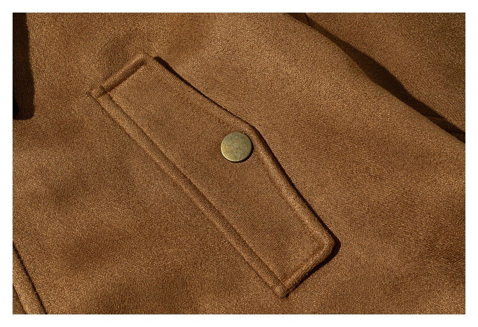 Close-up of a camel jacket's narrow flap and round metal snap.