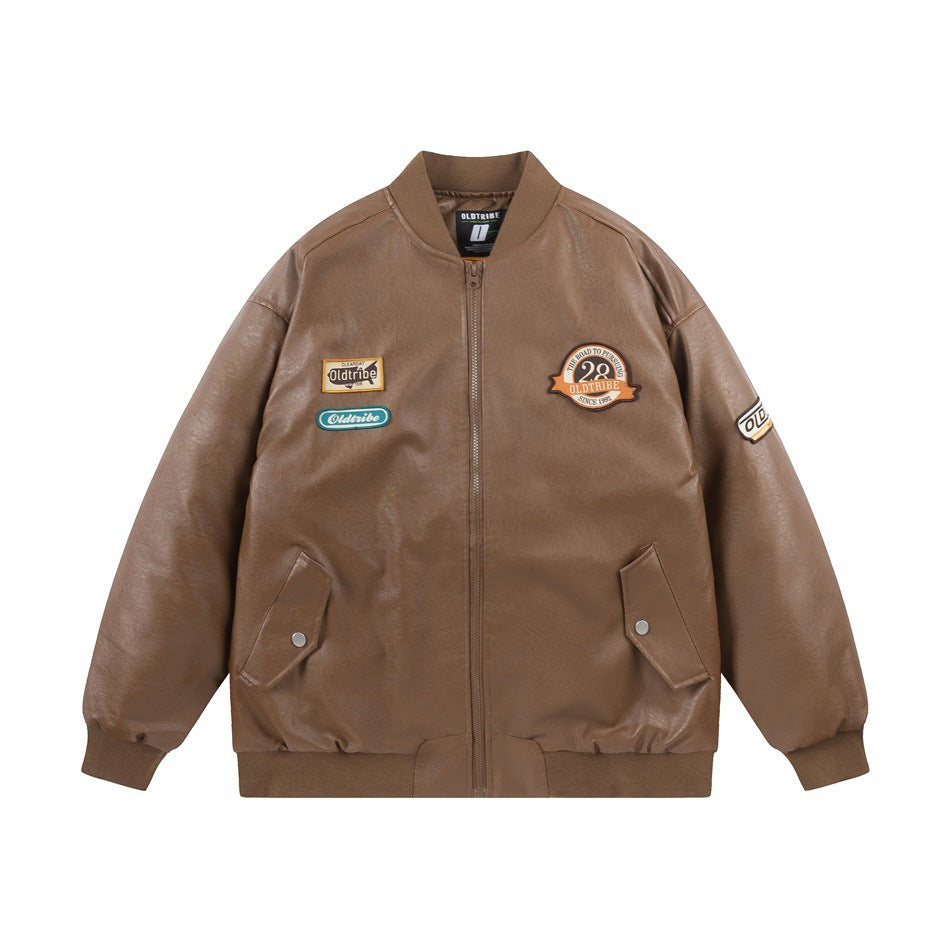 Brown faux-leather-look bomber jacket flat lay with front zipper, snap flap pockets, ribbed trim and embroidered patches