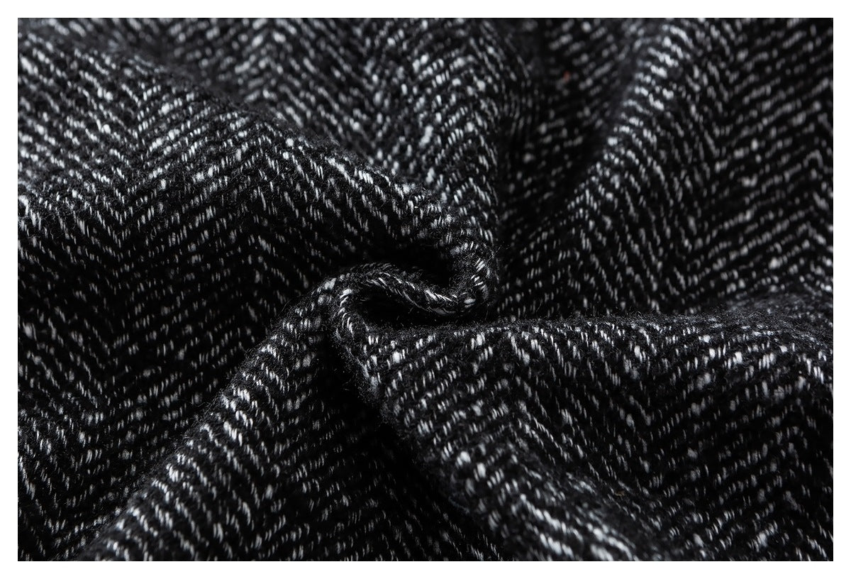 Close-up of the black-and-white herringbone pattern, with the fabric gathered to show its texture.