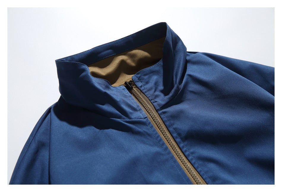 Close-up of the jacket's raised collar, tan lining, and brown zipper.