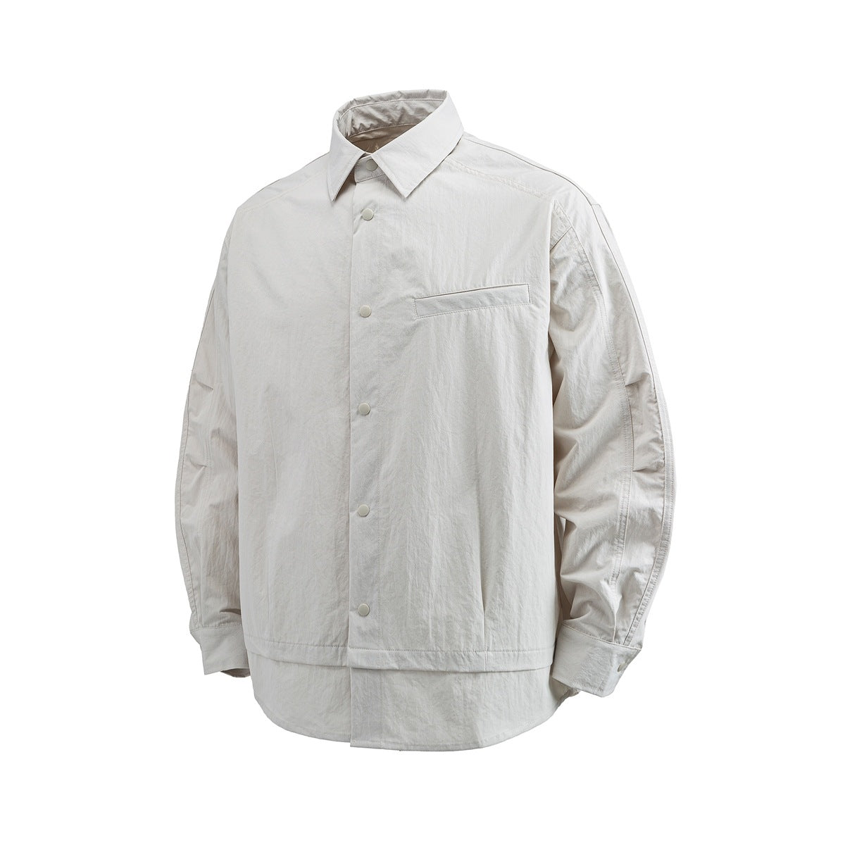 Beige long-sleeve snap-front shirt with pointed collar, chest welt pocket and layered hem, front view