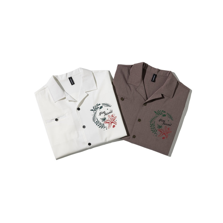 White and brown short-sleeve shirts folded to show their collars, button fronts, and matching chest graphics.