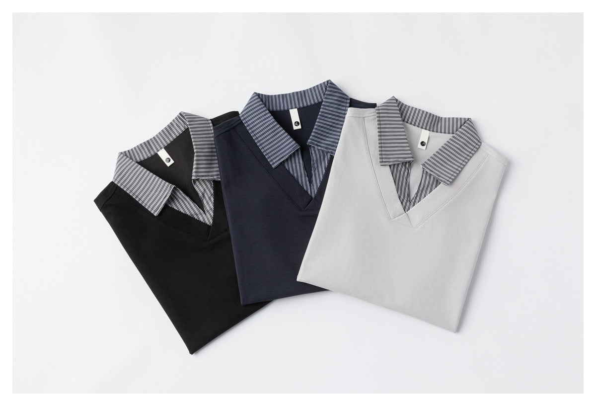 Three folded short-sleeve polo-style tops in black, navy and light gray, each with a striped collar