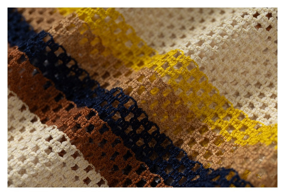 Close-up showing the garment's open-knit texture and cream, mustard, tan, navy, and rust stripes.