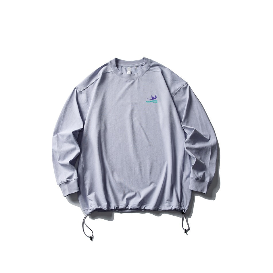 Light lavender long-sleeve crew-neck top flat lay with drawstring hem and small chest print
