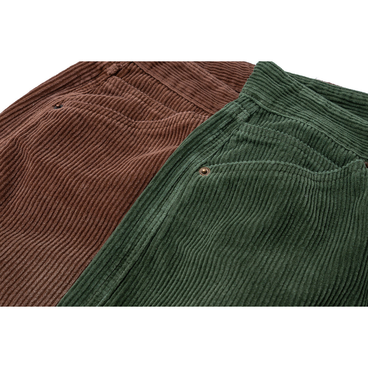 Close-up of brown and dark green corduroy shorts arranged together, showing pocket details.