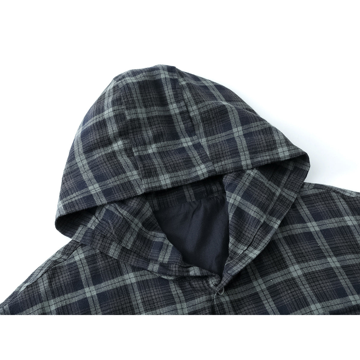Close-up of a dark navy and gray plaid hood and neckline on a button-front shirt.