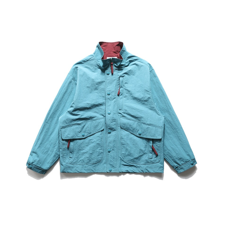 Lake blue stand-collar jacket, front flat lay, with burgundy zipper pulls, snap placket and large flap pockets