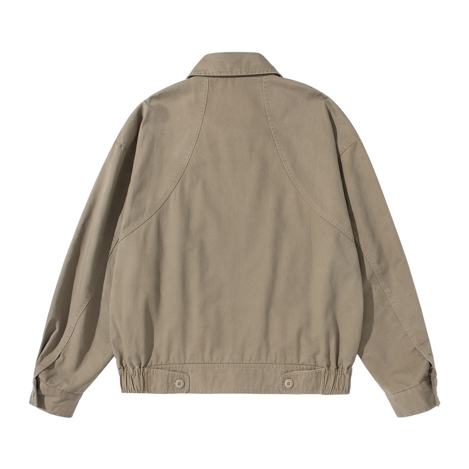 Khaki jacket back view with curved panel seams, collar and two button tabs at the elastic hem