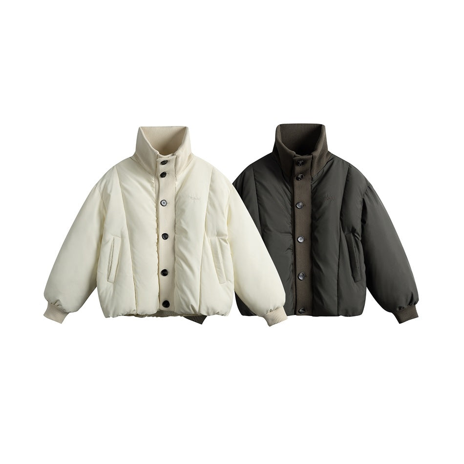 Two padded jackets shown from the front: one ivory and one dark charcoal, both with tall knit collars and button fronts.