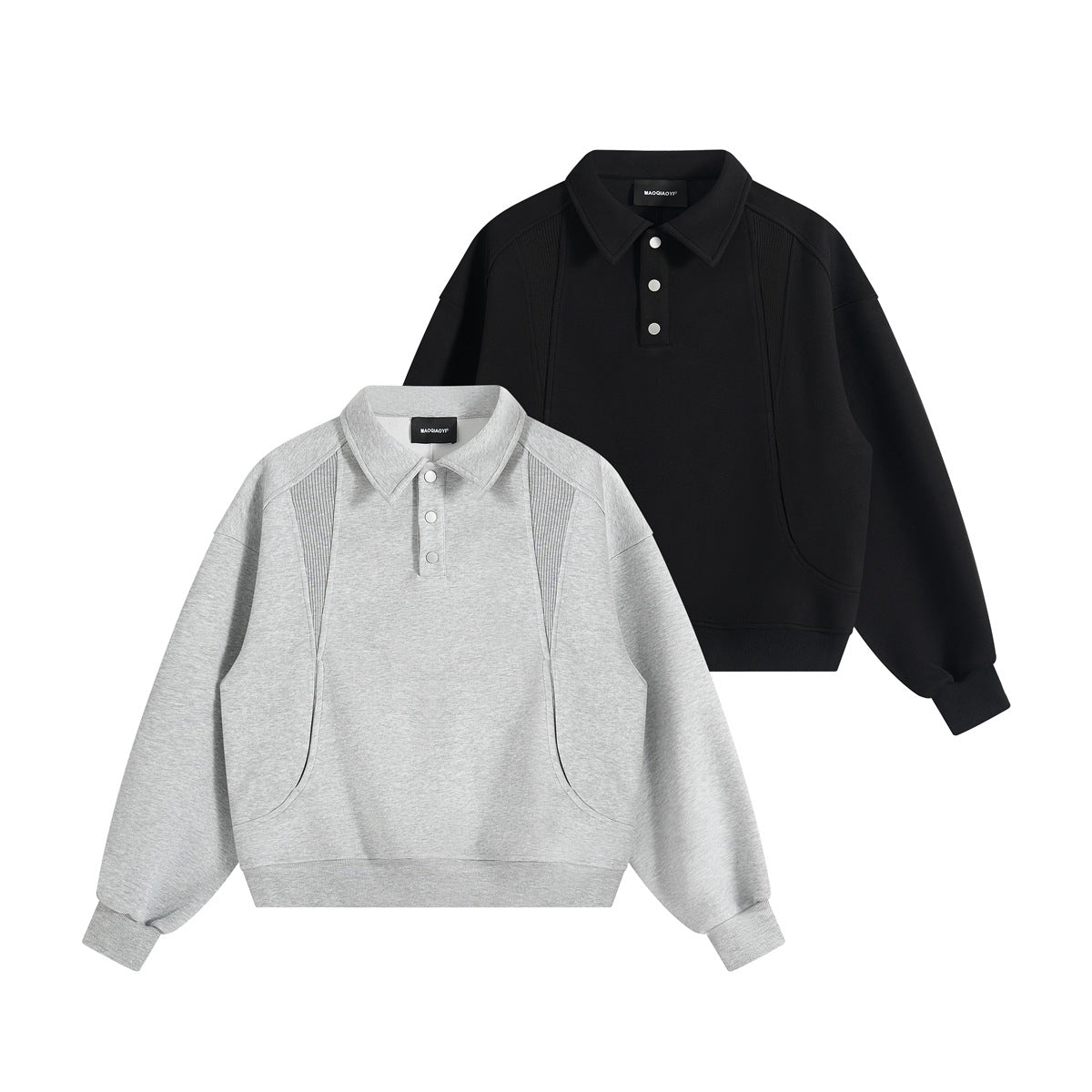 Two collared sweatshirts shown from the front: light gray in front and black behind, each with snap buttons and ribbed