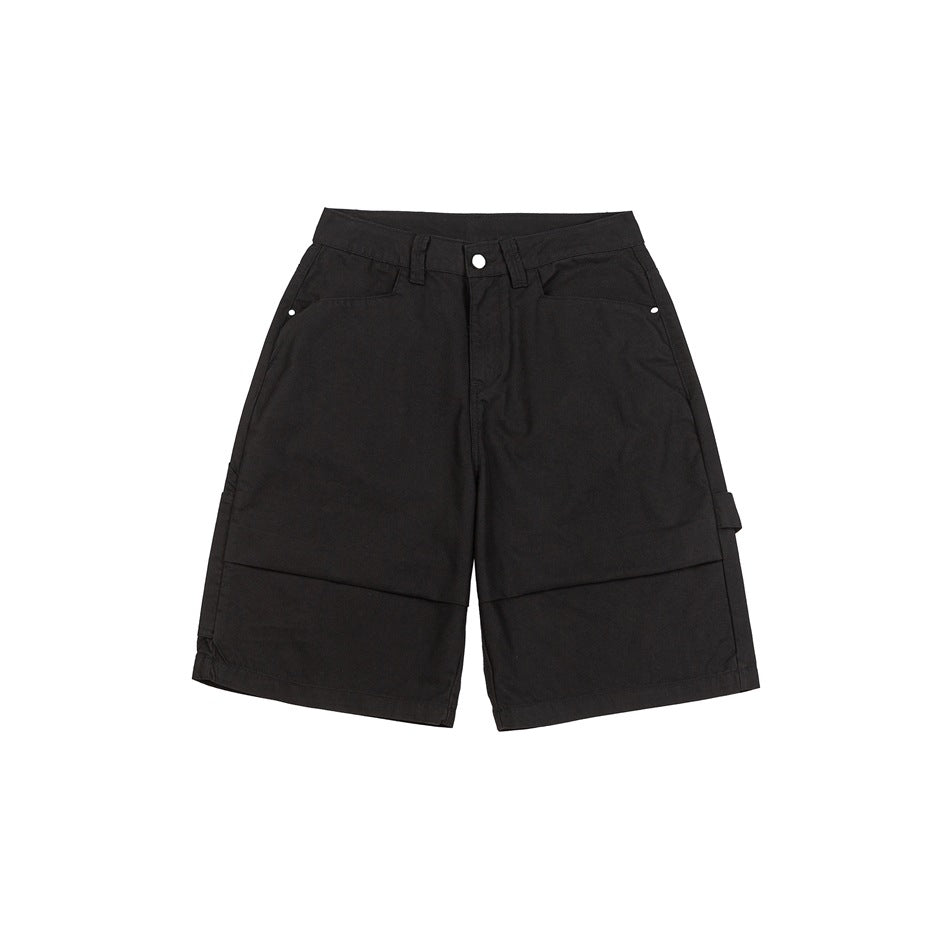 Black knee-length carpenter shorts, front flat lay, with button fly, slant pockets and side hammer loop