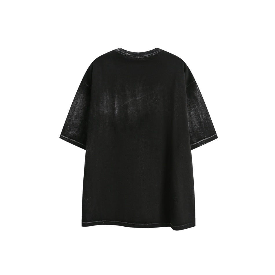 Back view of an oversized black short-sleeve crew-neck T-shirt with a washed finish against a white background.