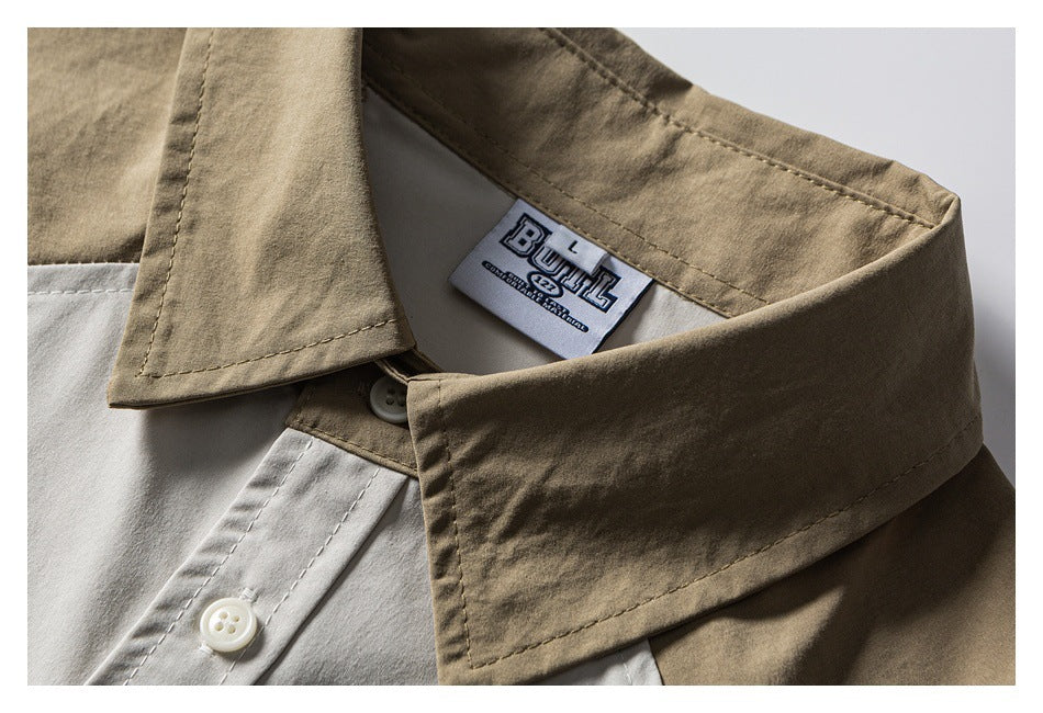 Close-up of a khaki collar and white placket with buttons and a sewn neck label.