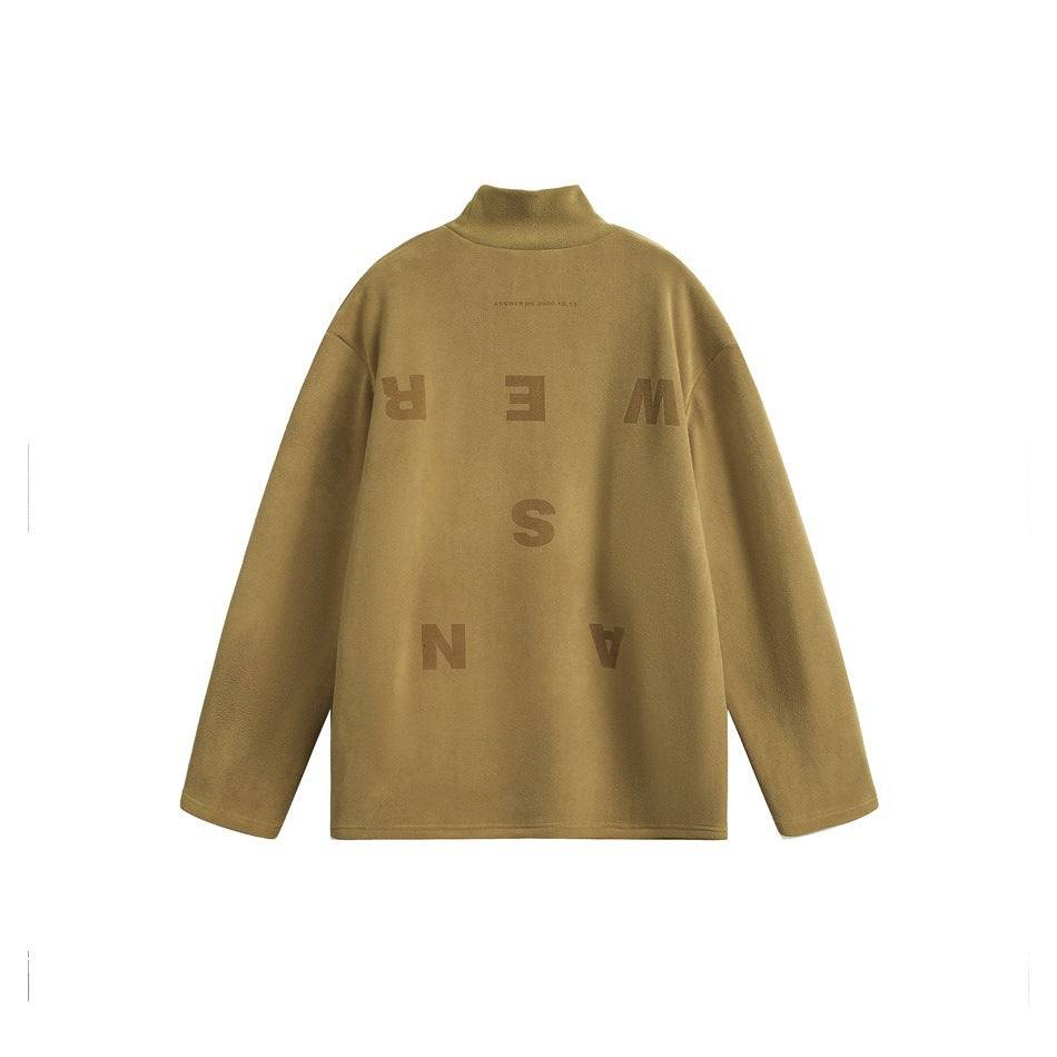 Mustard high-neck long-sleeve top shown from the back, with large scattered lettering.