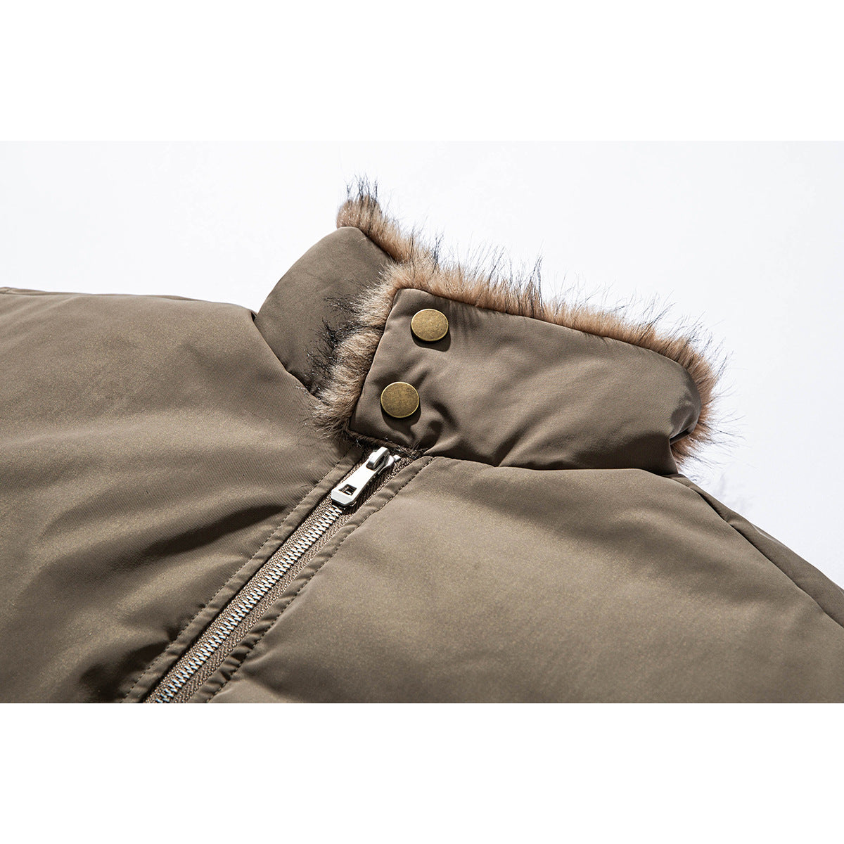 Close-up of a taupe jacket collar with faux-fur trim, brass-tone snaps, and a silver zipper.