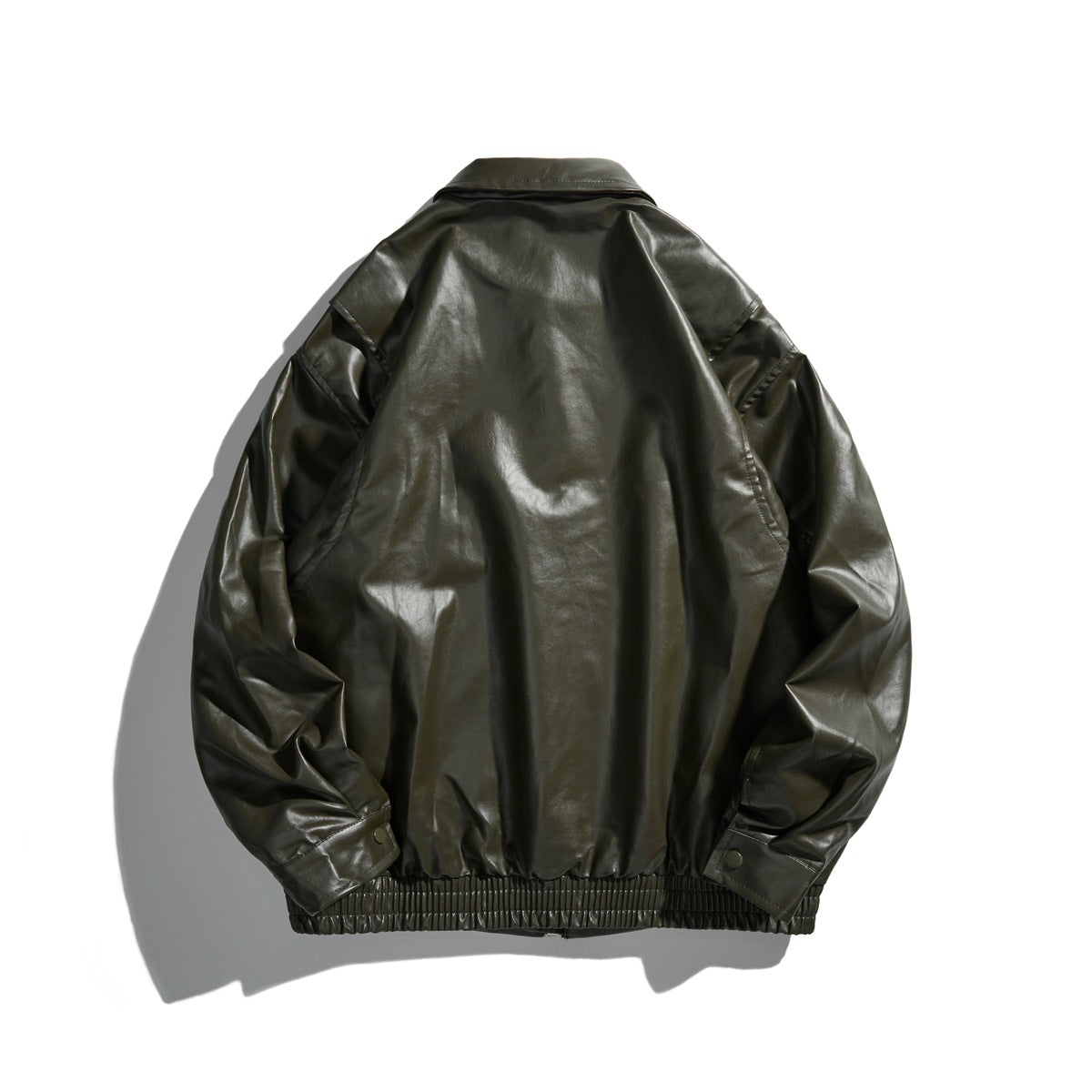 Back view of an olive jacket with a pointed collar, gathered ribbed hem, and cuff tabs.