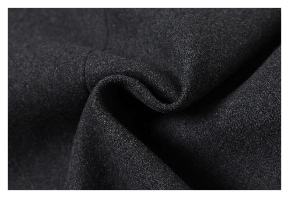 Close-up showing the texture and drape of dark charcoal fabric.