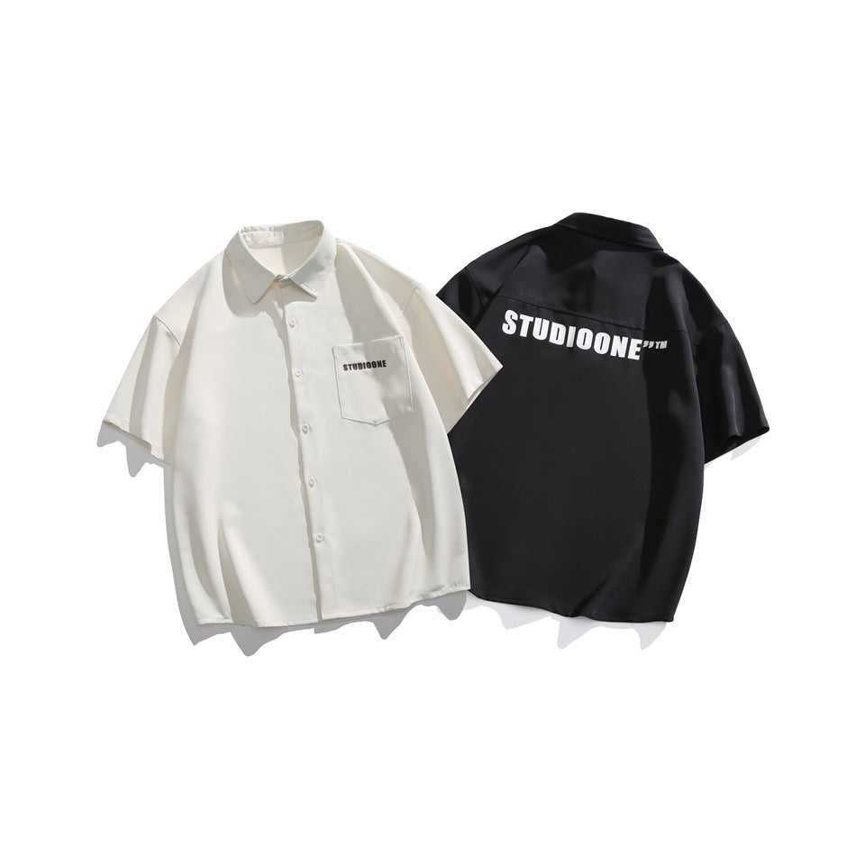 Ivory shirt shown from the front beside a black shirt shown from the back, both with printed lettering.