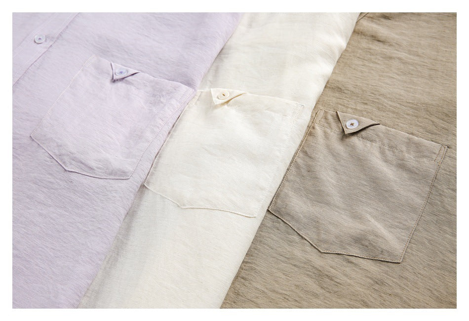 Close-up of shirt fronts and buttoned chest pockets in lavender, ivory, and taupe.