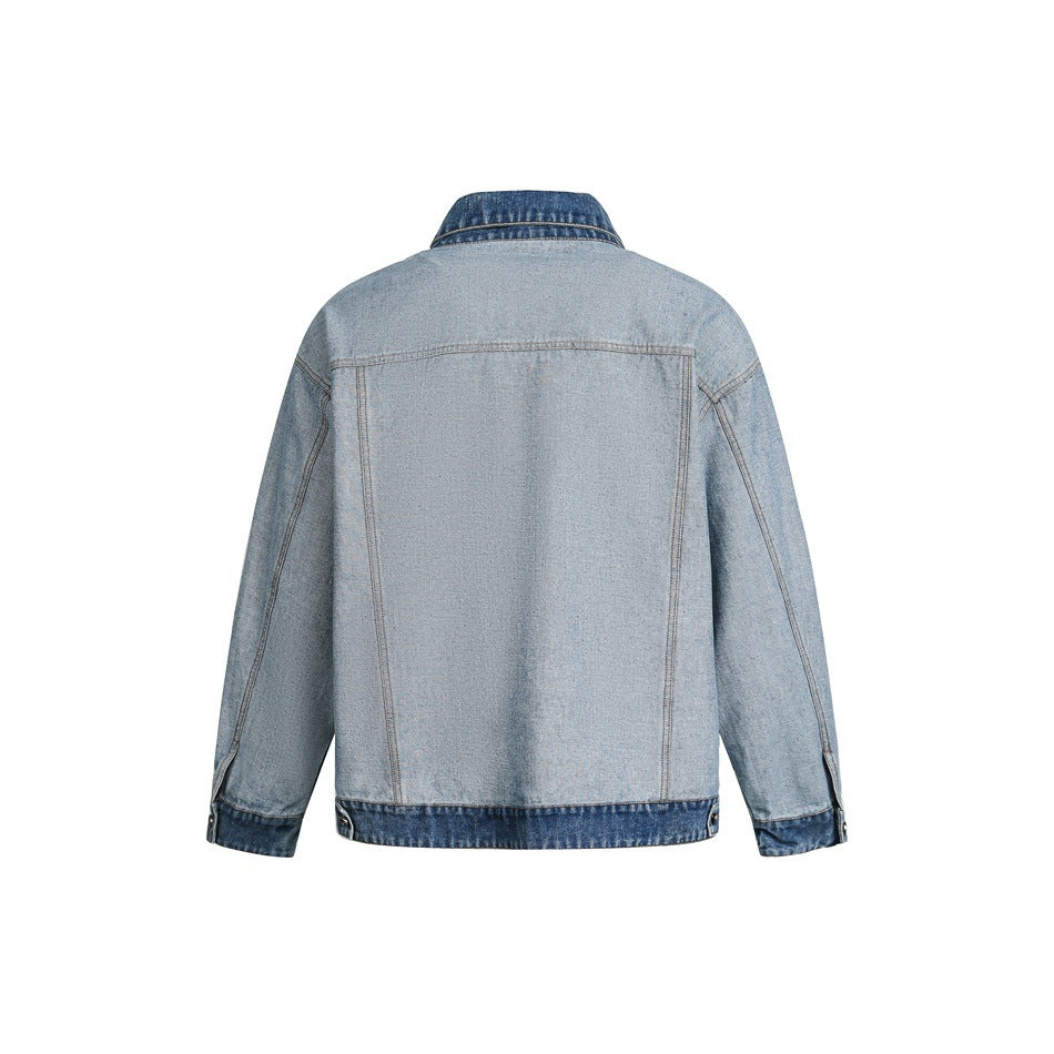 Back view of a light blue denim jacket with a darker denim collar, cuffs, and hem.