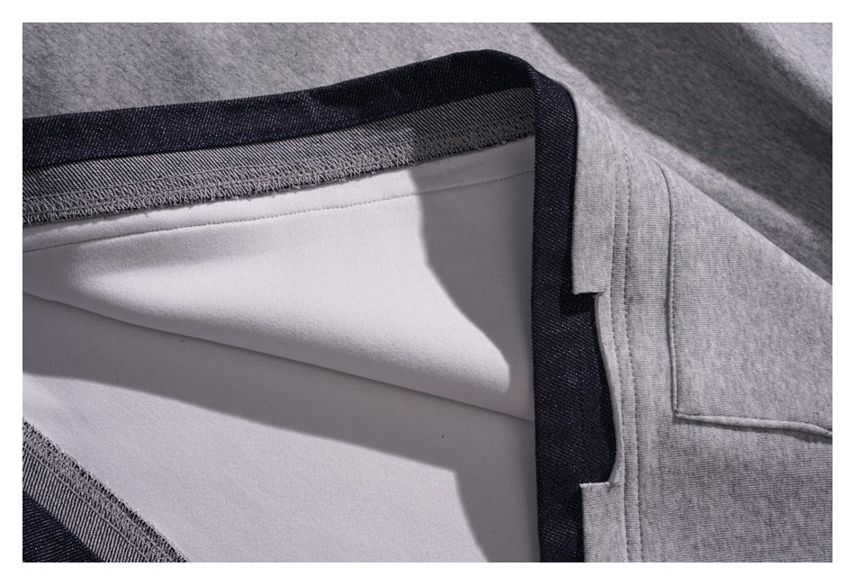 Close-up of the hoodie’s inner seam, showing pale lining and dark binding along the edge.