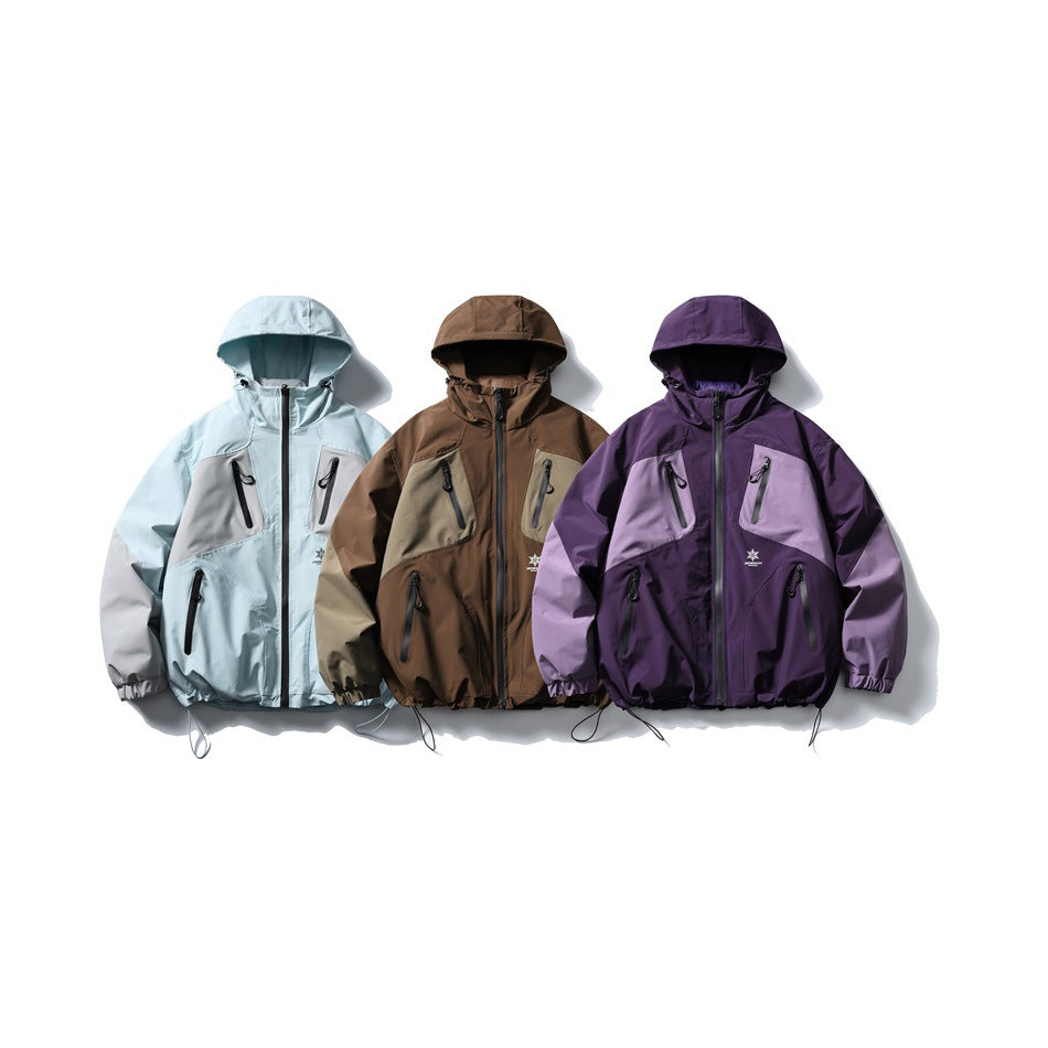 Three hooded color-block jackets shown together in pale blue, brown, and purple.