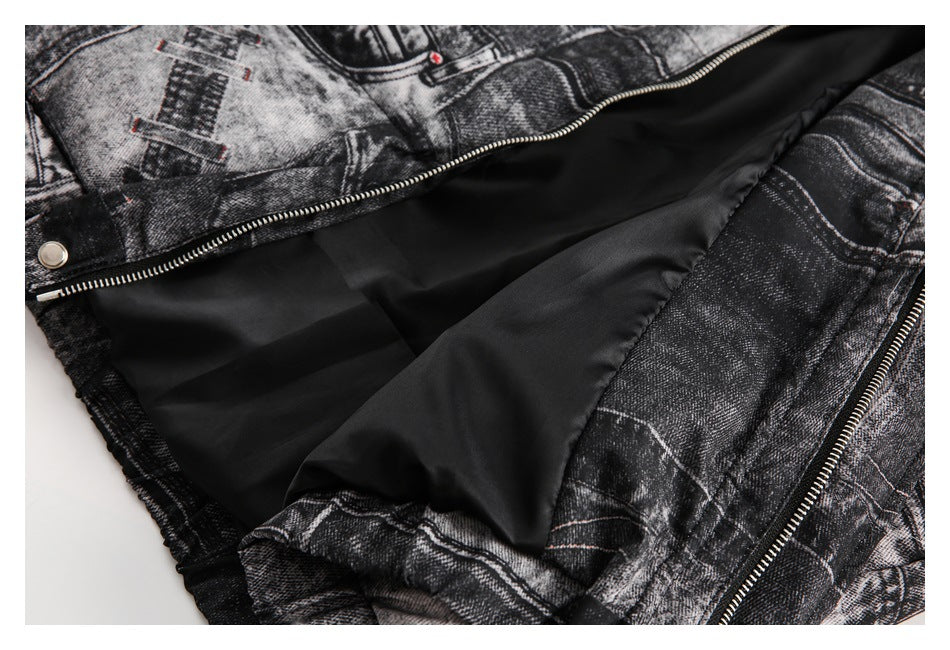 Close-up of a black-and-gray printed denim jacket opened to show smooth black lining and a silver zipper.
